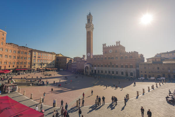 Siena, Tuscany, Italy, Europe. Panoramic view of Piazza del Campo with the historical Palazzo Pubblico and its Torre del Mangia.