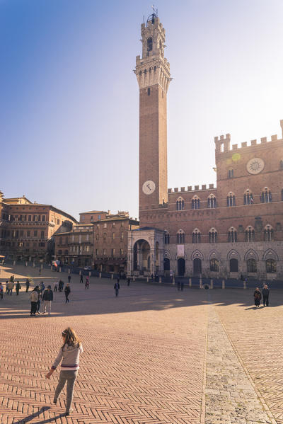 Siena, Tuscany, Italy, Europe. View of Piazza del Campo with the historical Palazzo Pubblico and its Torre del Mangia.