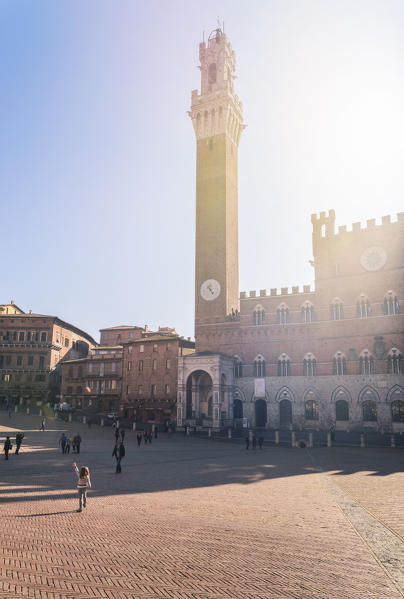 Siena, Tuscany, Italy, Europe. View of Piazza del Campo with the historical Palazzo Pubblico and its Torre del Mangia.