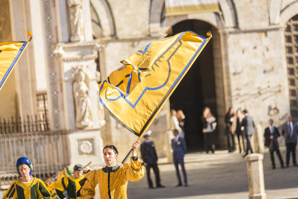 Typical exhibition of traditional clothes and flags of the different contradas Piazza del Campo Siena Tuscany Italy Europe