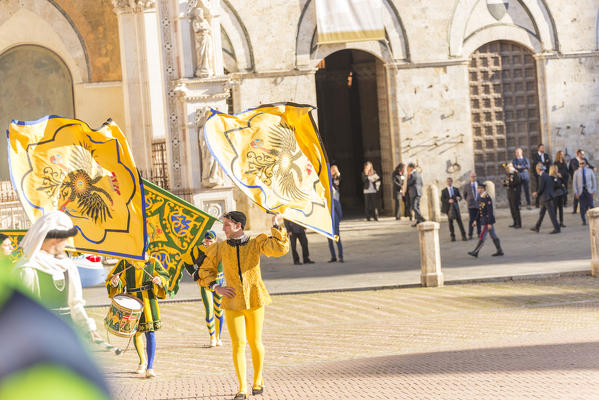 Typical exhibition of traditional clothes and flags of the different contradas Piazza del Campo Siena Tuscany Italy Europe