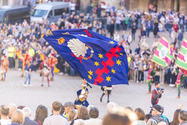 Typical exhibition of traditional clothes and flags of the different contradas Piazza del Campo Siena Tuscany Italy Europe