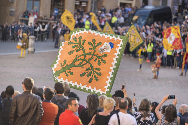 Typical exhibition of traditional clothes and flags of the different contradas Piazza del Campo Siena Tuscany Italy Europe
