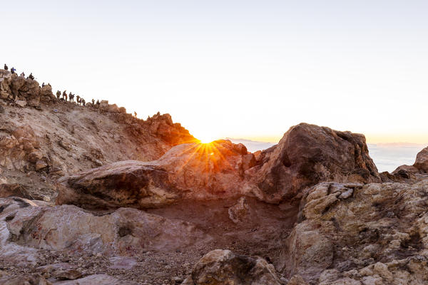 Spain,Canary Islands,Tenerife,hikers admire the sunrise from the top of Teide volcano