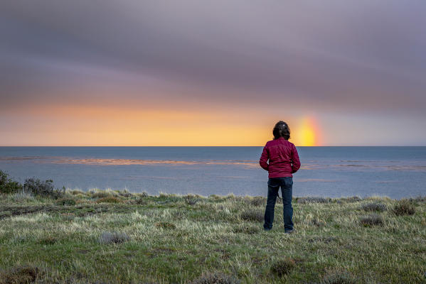Chile,Patagonia,Region of Magellan and Chilean Antarctica,on the road to Punta Arenas,a man admires the sunset