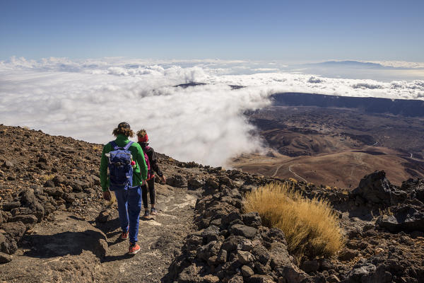 Spain,Canary Islands,Tenerife,Pico de Teide,tourists descend from the top of the Teide volcano along the path