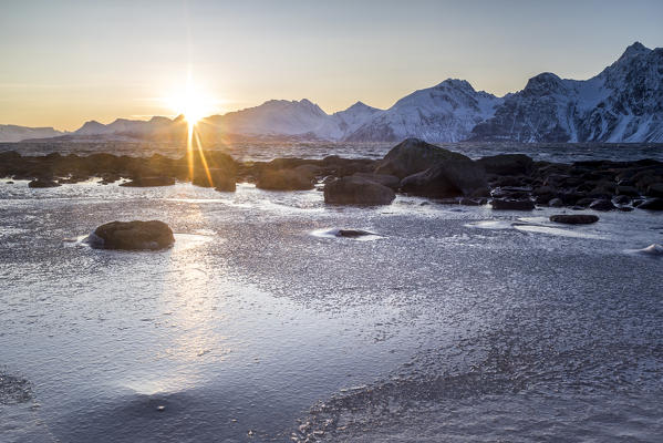 The sun sets behind the Lyngen Alps,Kåfjord,Troms,Norway,Europe