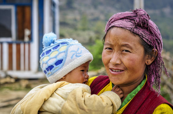 Mom holds her little son in her arms,Rasuwa district, Bagmati region,Nepal,Asia