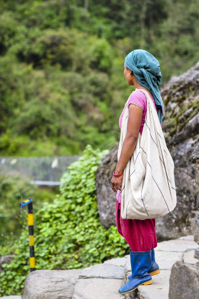 Young woman is getting ready to work in the fields,Annapurna region,Nepal, Asia