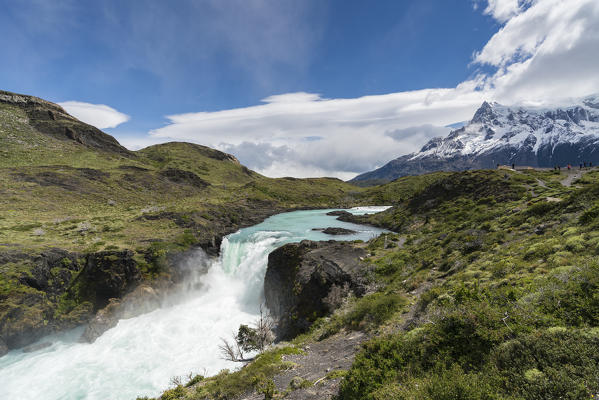 Salto Grande waterfall, with Cerro Paine Grande, in summer. Torres del Paine National Park, Ultima Esperanza province, Magallanes region, Chile.