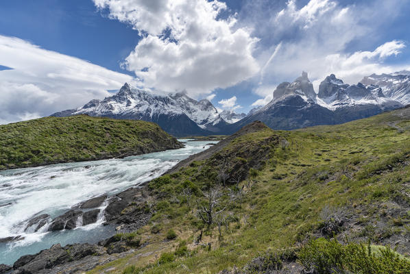 Salto Grande waterfall, with Cerro Paine Grande, Paine Horns and Cerro Paine in summer. Torres del Paine National Park, Ultima Esperanza province, Magallanes region, Chile.