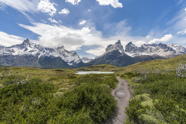 Footpath to Mirador Cuernos, with Cerro Paine Grande, Paine Horns, Cerro Paine and Nordenskjold Lake in summer. Torres del Paine National Park, Ultima Esperanza province, Magallanes region, Chile.