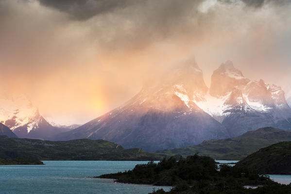 Pehoé Lake with Paine Horns covered in mist at dawn. Torres del Paine National Park, Ultima Esperanza province, Magallanes region, Chile.