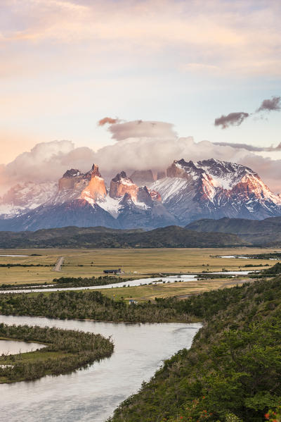 Paine Horns and Cerro Paine at dawn, with Serrano river in the foreground. Torres del Paine National Park, Ultima Esperanza province, Magallanes region, Chile.