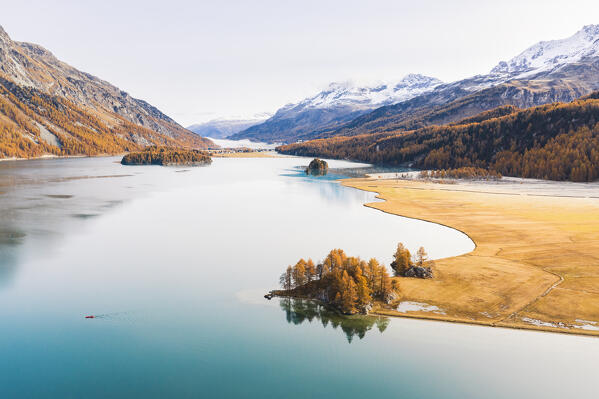 Switzerland, Canton of the Grisons, Maloja region, Sils im Engadin/Segl: Lake Sils in autumn, with Lake Silvaplana covered in mist far in the background.