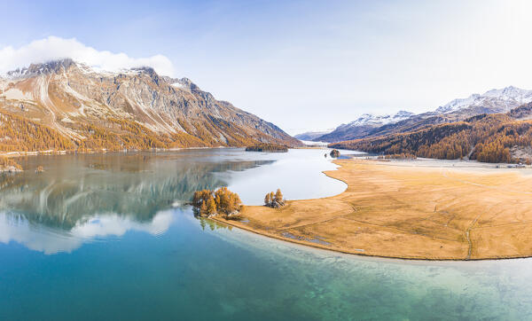 Switzerland, Canton of the Grisons, Maloja region, Sils im Engadin/Segl: Lake Sils in autumn, with Lake Silvaplana covered in mist far in the background.
