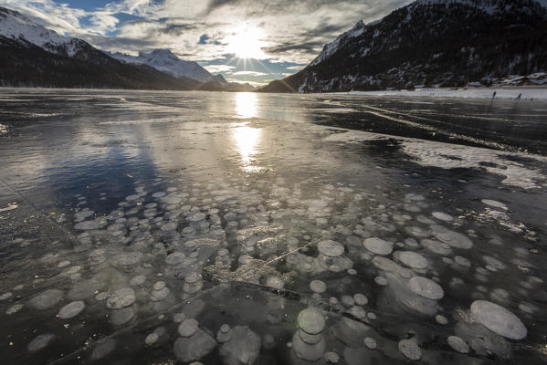 Frozen gas bubbles trapped in the ice. Silvaplana Lake, Silvaplana, Engadin, Graubunden, Switzerland, Europe.