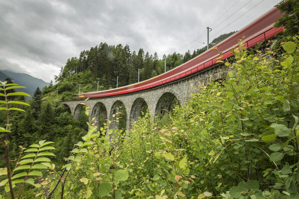 Red Bernina Express train, Filisur, Graubunden, Switzerland
