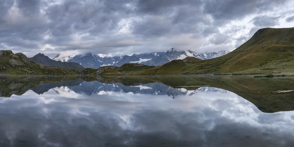 Cloudy sky over Fenetre Lake and the Mont Blanc massif, Ferret valley, Switzerland