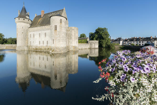 Medieval castle with flowers on the foreground. Sully-sur-Loire, Loiret, France.