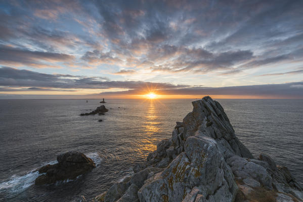Vieille lighthouse from Raz point at sunset. Plogoff, Finistère, Brittany, France.
