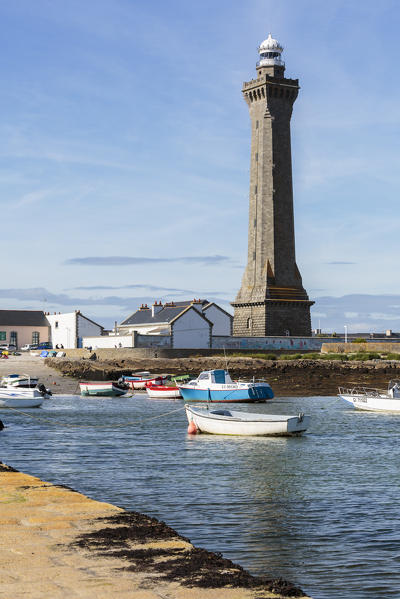 Lighthouse with pier and boats. Penmarch, Finistère, Brittany, France.