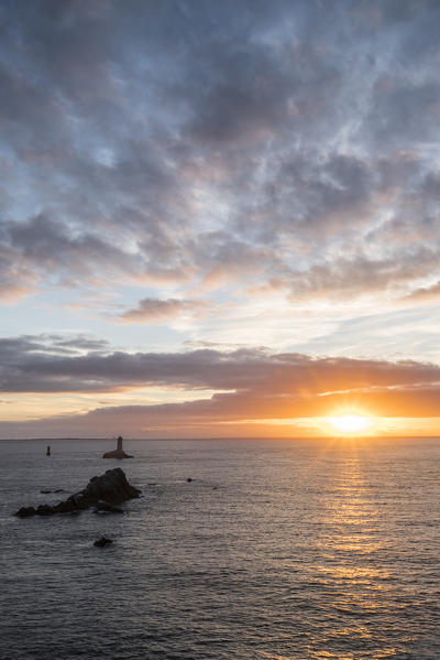 Vieille lighthouse from Raz point at sunset. Plogoff, Finistère, Brittany, France.