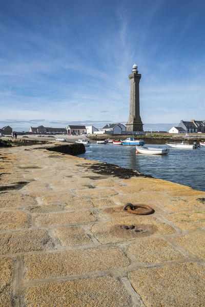 Lighthouse with pier and boats. Penmarch, Finistère, Brittany, France.