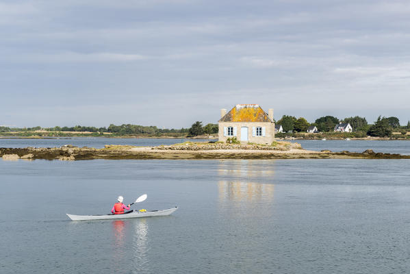 Canoeing in front of the isle of Saint-Cado. Quiberon, Morbihan, France.