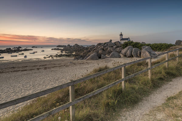 Sunset behind Pontusval lighthouse. Brignogan Plage, Finistère, Brittany, France.