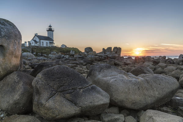 Sunset behind Pontusval lighthouse. Brignogan Plage, Finistère, Brittany, France.