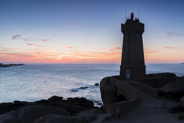 Ploumanach lighthouse at sunset. Perros-Guirec, Côtes-d'Armor, Brittany, France.
