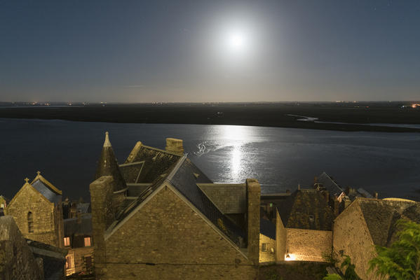 Moonlight over the bay shot from the fortress. Mont-Saint-Michel, Normandy, France.