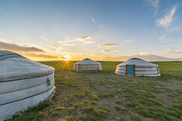 Mongolian nomadic traditional gers while the sun sets. Middle Gobi province, Mongolia.