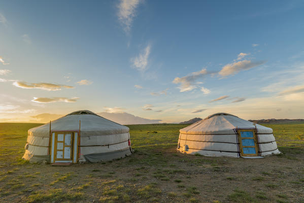 Mongolian nomadic traditional gers at sunset. Middle Gobi province, Mongolia.