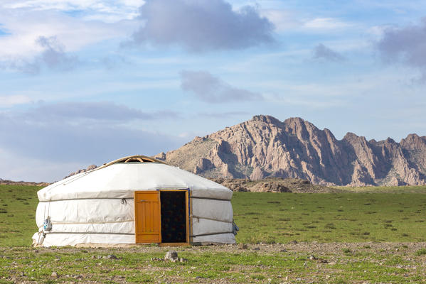 Mongolian ger in the countryside and mountains in the background. Middle Gobi province, Mongolia.