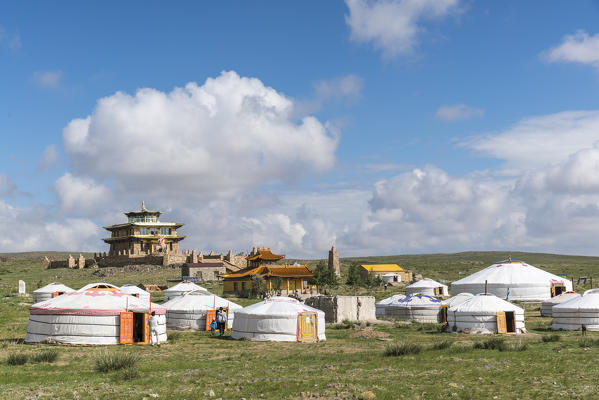 Ger camp and Tsorjiin Khureenii temple in the background. Middle Gobi province, Mongolia.