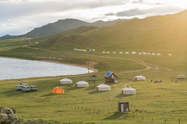 Golden light on a family ger camp on the shores of White Lake. Tariat district, North Hangay province, Mongolia.