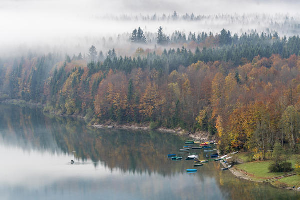 Boats on the shores of Sylvenstein Lake. Bad Tölz-Wolfratshausen district, Bavaria, Germany.