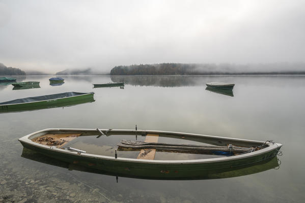 Boats on Sylvenstein Lake in the morning. Bad Tölz-Wolfratshausen district, Bavaria, Germany.
