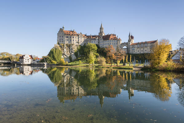 Sigmaringen castle reflects itself on the Danube river. Sigmaringen, Baden-Württemberg, Germany.