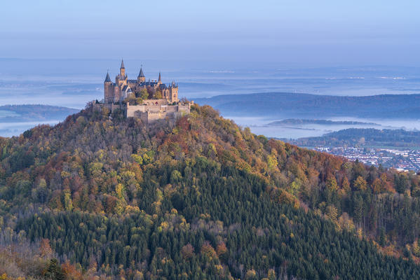 Hohenzollern castle in autumnal scenery at dusk. Hechingen, Baden-Württemberg, Germany.