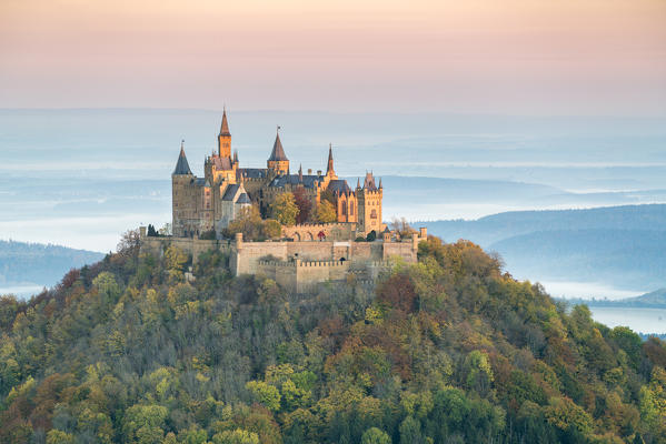 Hohenzollern castle in autumnal scenery at dawn. Hechingen, Baden-Württemberg, Germany.