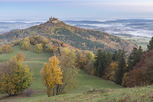 Hohenzollern castle in autumnal scenery at dusk. Hechingen, Baden-Württemberg, Germany.