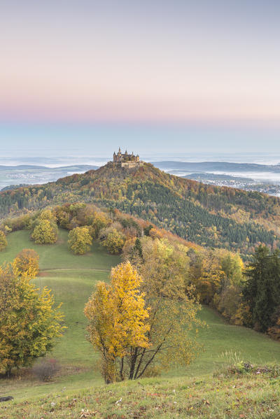 Hohenzollern castle in autumnal scenery at dawn. Hechingen, Baden-Württemberg, Germany.