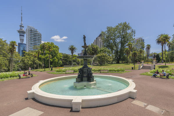Fountain in Albert Park and Sky Tower in the left background. Auckland City, Auckland region, North Island, New Zealand.