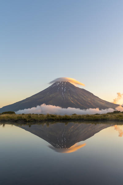 Reflection of Mount Taranaki at sunset. Egmont National Park, New Plymouth district, Taranaki region, North Island, New Zealand.