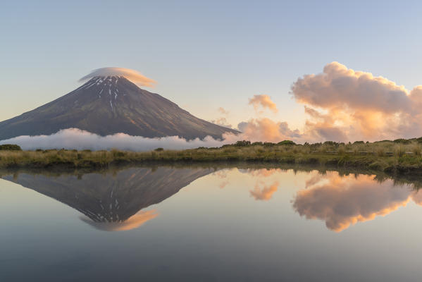 Reflection of Mount Taranaki at sunset. Egmont National Park, New Plymouth district, Taranaki region, North Island, New Zealand.