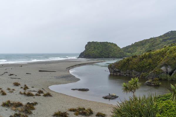 Ship Creek reaching Tasman Sea. Haast, West Coast region, South Island, New Zealand.