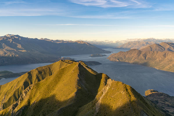 View of Lake Wanaka from Roys Peak lookout before sunset. Wanaka, Queenstown Lakes district, Otago region, South Island, New Zealand.